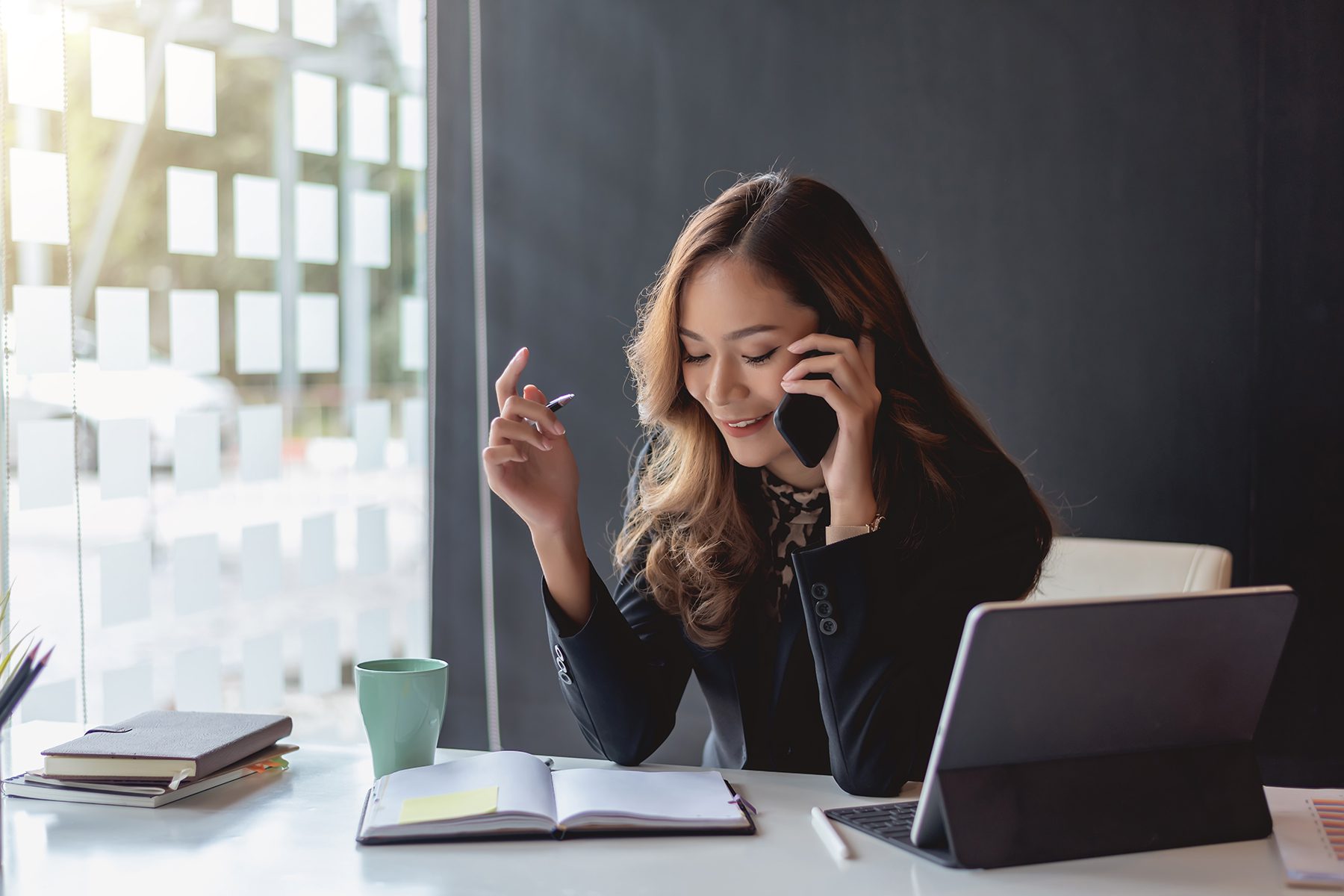 Professional woman working in a bright San Bernardino office setting