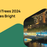 ChariTrees 2024 event highlights in vibrant Singapore nightscape.