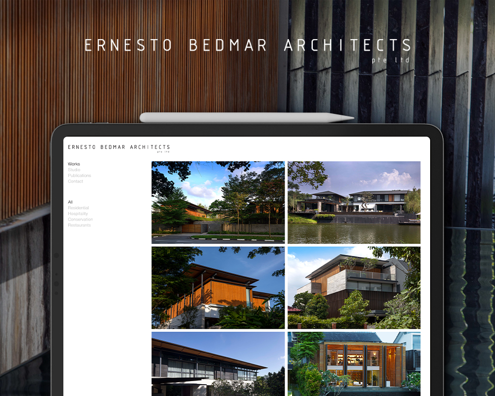 Tablet displaying a modern architectural design firm's website portfolio.