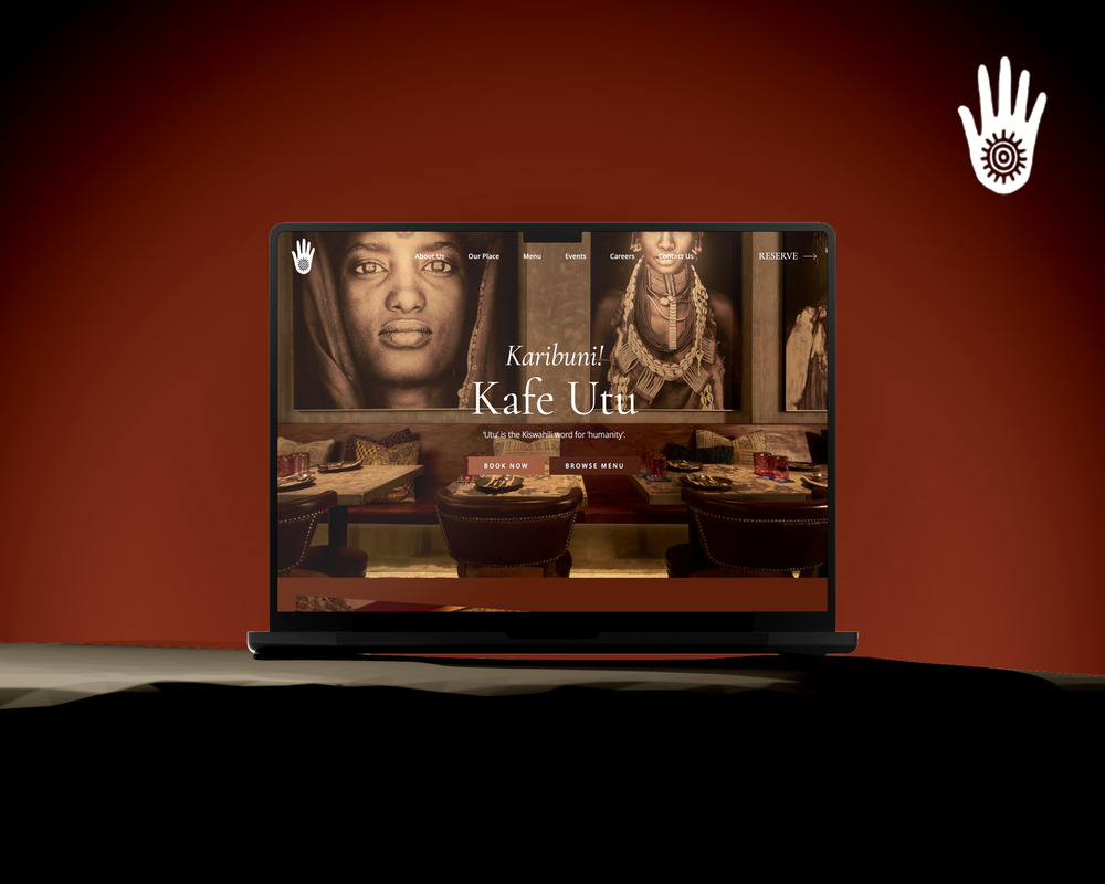 Laptop displaying Kafe Utu website design on a gradient background.